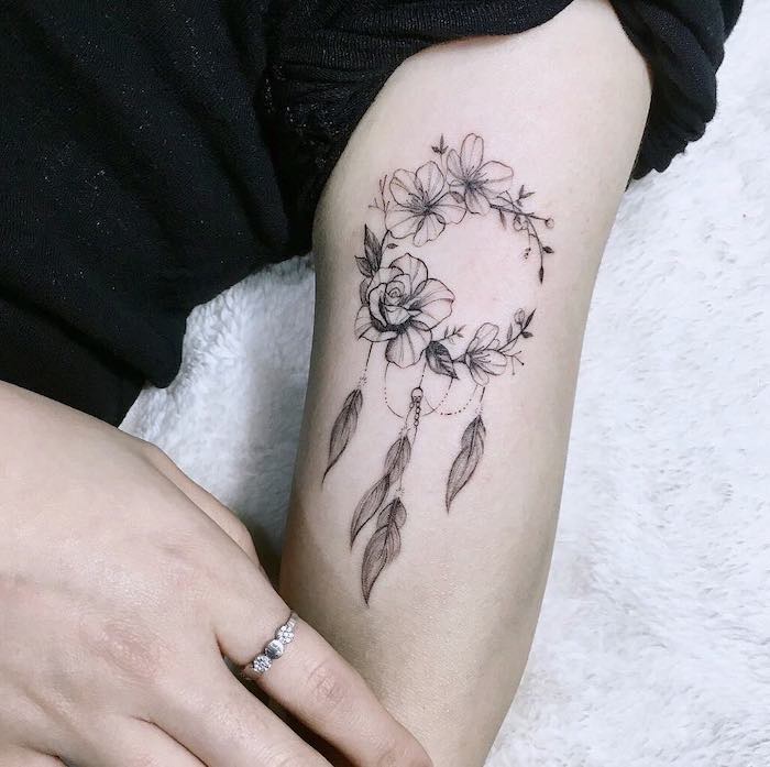 dreamcatcher tattoo on inner arm