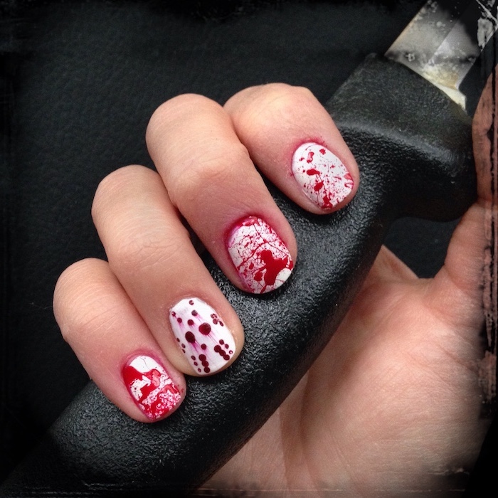 bloody nails, black and gold nail designs, jason voorhees, hand holding a knife, black background, short nails