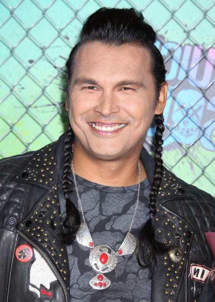 adam beach, two long side braids, black hair, braided hair men, black leather jacket, grey t shirt, silver necklace