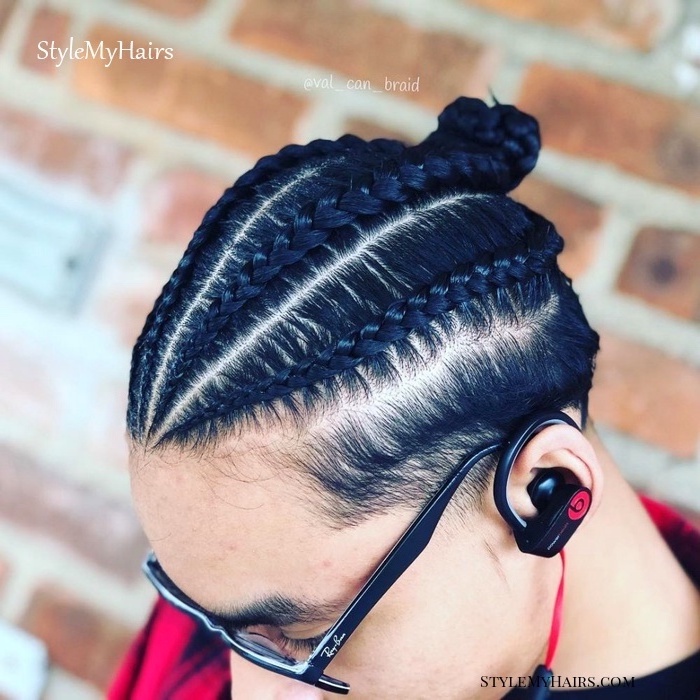 man with black hair, ray ban glasses, beats by dre headphones, brick wall, braided hair men