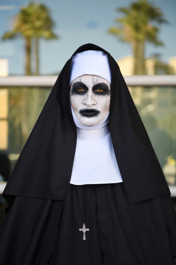 woman dressed as the nun, from the conjuring, scary face make up, what should i be for halloween, contact lenses