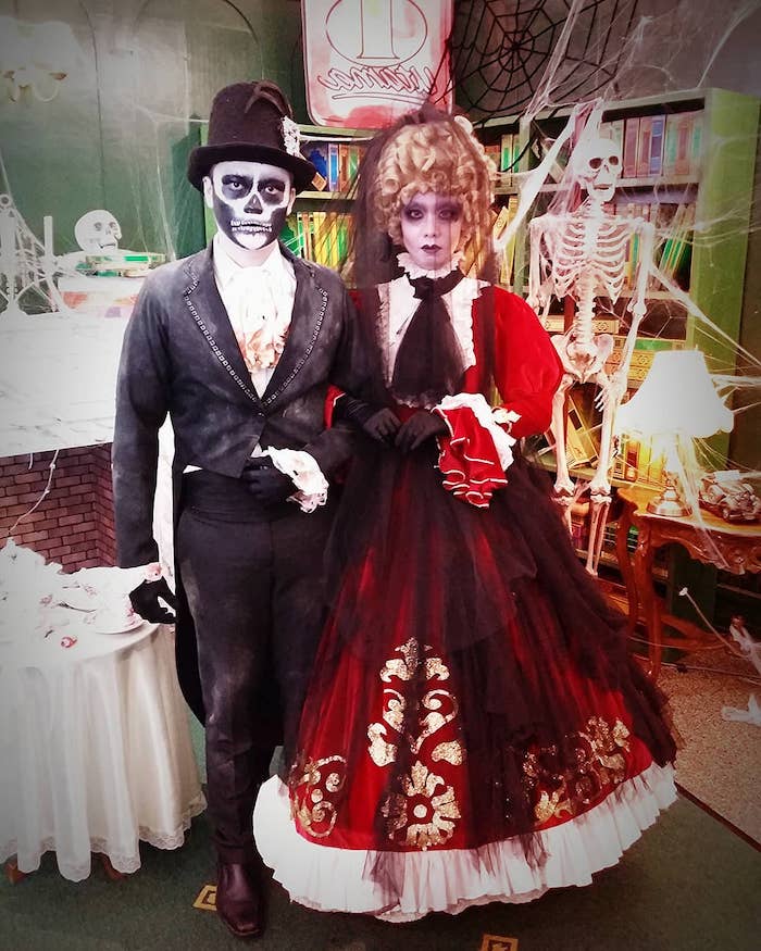 man dressed in a tuxedo, woman with red dress, black veil, creative halloween costumes, scary face make up