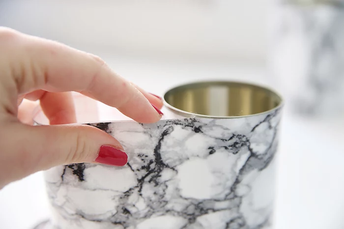 tin can, covered in marble paper, office desk decor, woman with red nail polish, step by step, diy tutorial