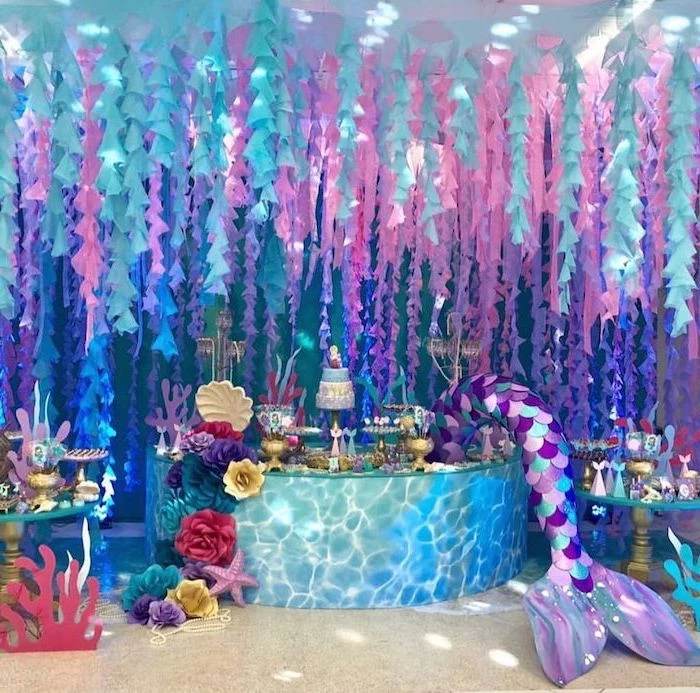intricate decor, dessert table, mermaid baby shower, pink purple and turquoise decor, three tier cake