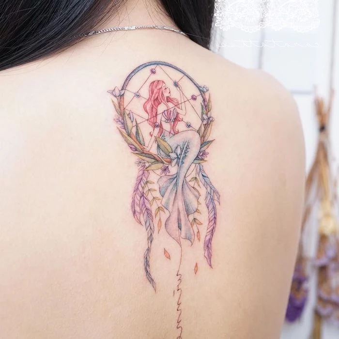mermaid inside a dreamcatcher, colored tattoo, dream catcher tattoo on thigh, back tattoo