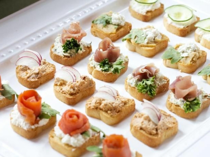 bruschetta bites, with salmon fillet, ham and cheese, brunch potluck ideas, white platter