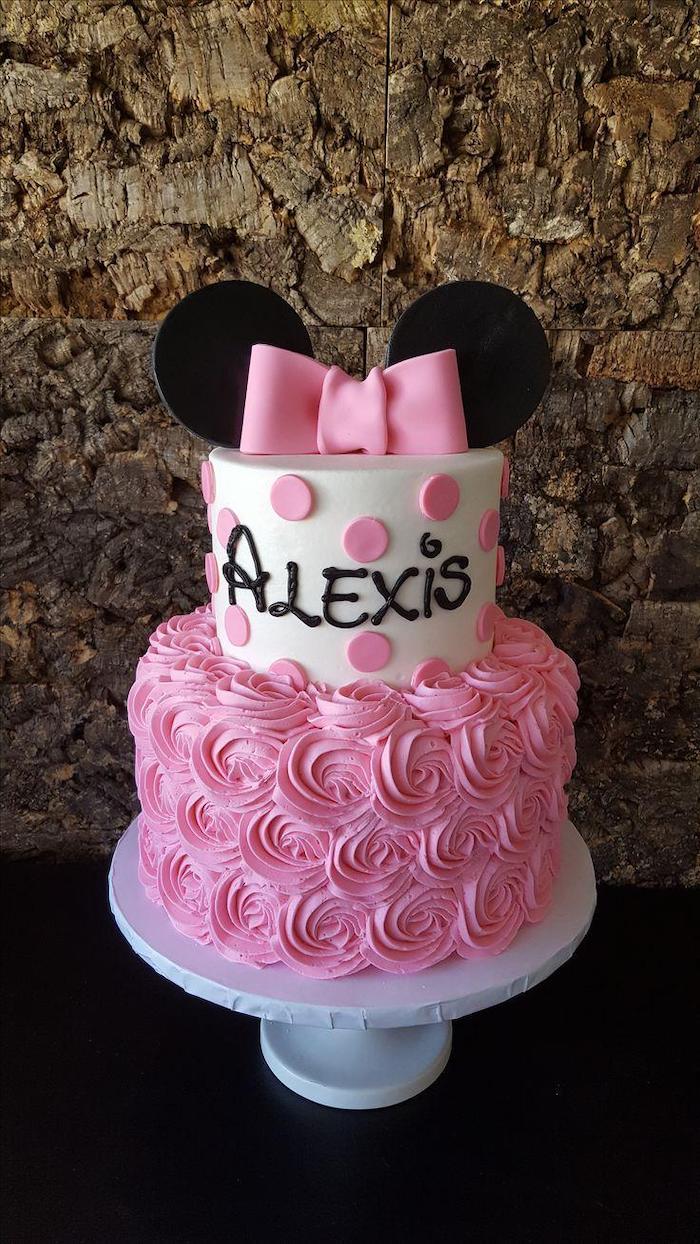 pink frosting, white fondant, two tier cake, minnie mouse cake ideas, white cake stand, pink bow