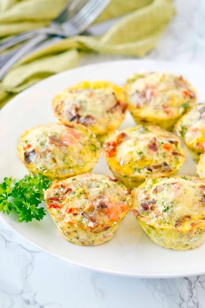 egg muffins, with peppers and tomatoes, brunch ideas, white plate, marble countertop