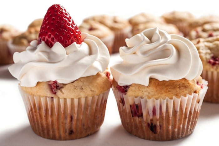 muffins with strawberries, cream on top, birthday breakfast ideas, white background