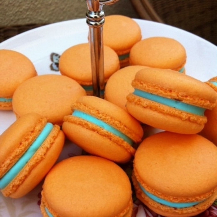 orange macarons, blue filling, breakfast and brunch, white plate