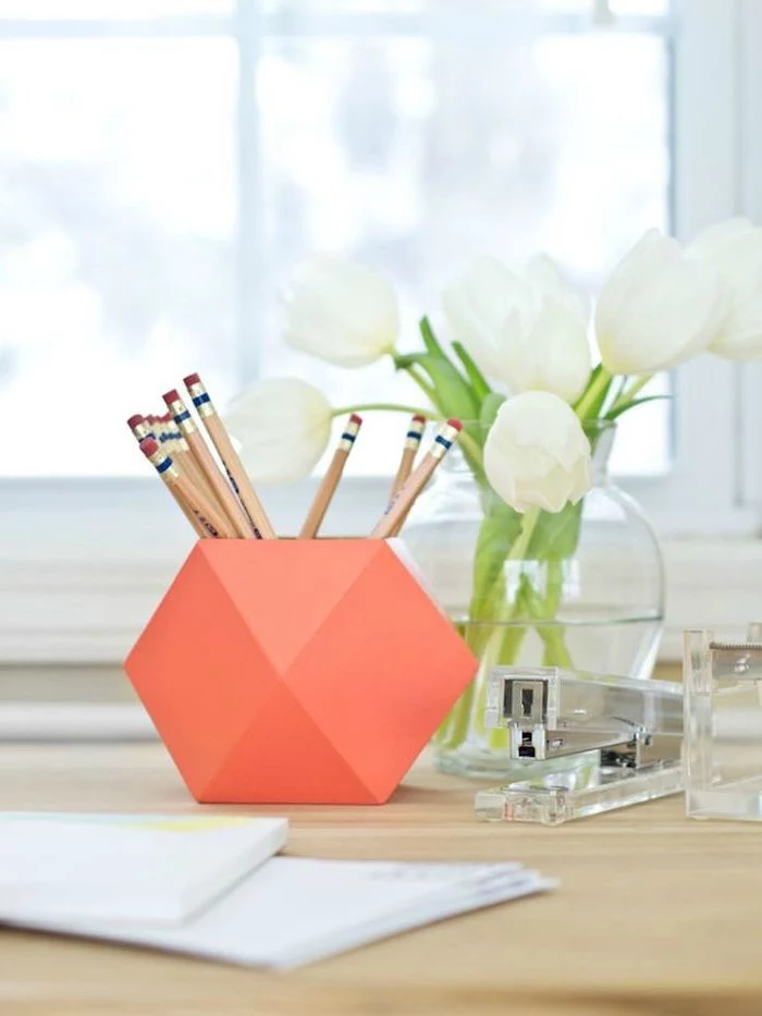 white tulips, flower bouquet, work office decor, orange pencil holder, on a wooden desk, acrylic stapler