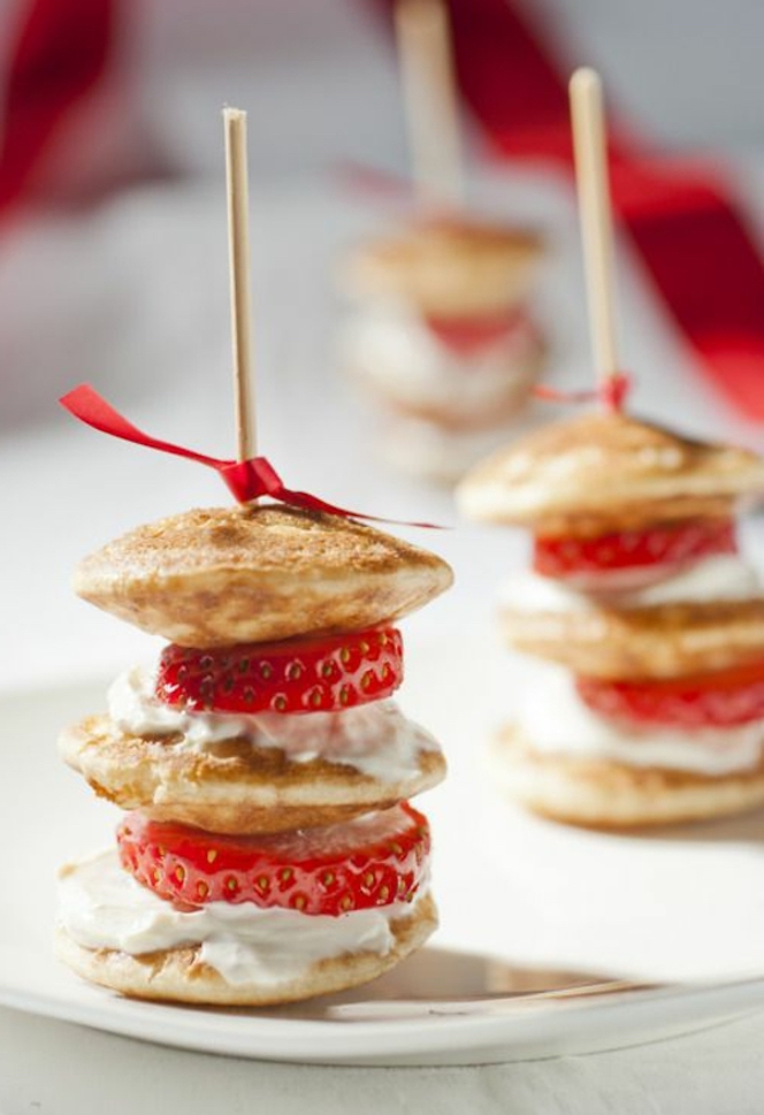 mini pancakes stack, with cream and strawberry, breakfast and brunch, red bow, white plate