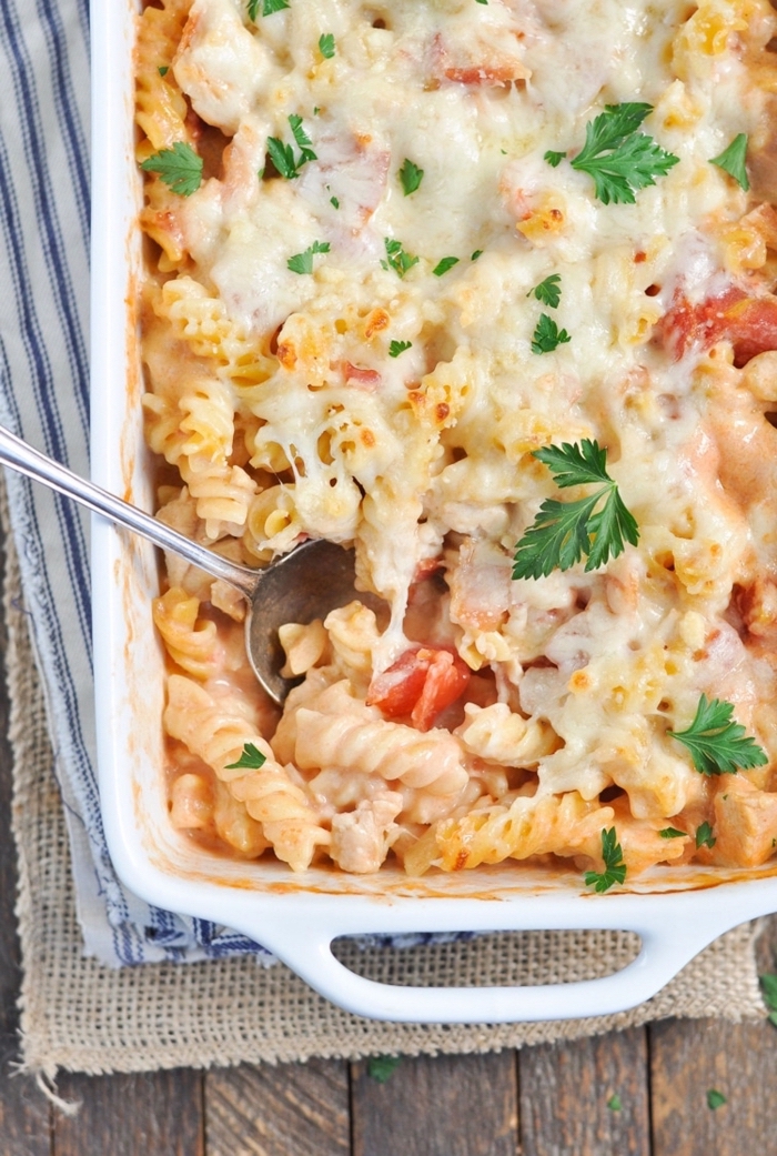 pasta casserole, with cheese and ham, breakfast sides, wooden table, silver spoon