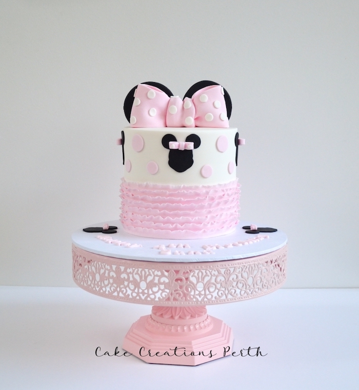 white fondant, pink frosting, pink bow, pink cake stand, black ears, minnie mouse cupcake cake
