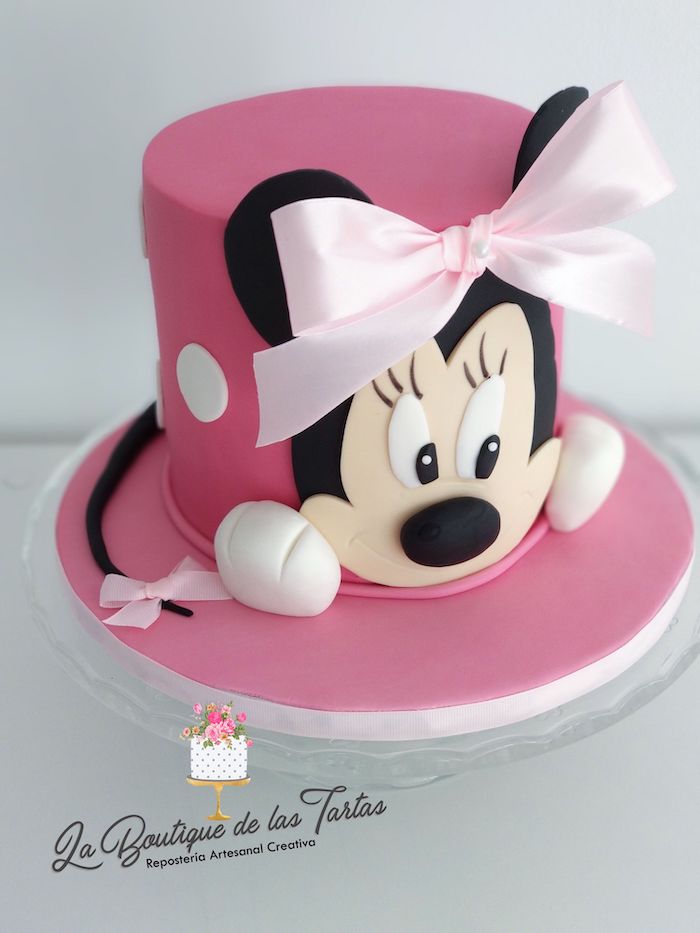 pink fondant, pink satin bow, minnie mouse cupcake cake, glass cake stand, white background