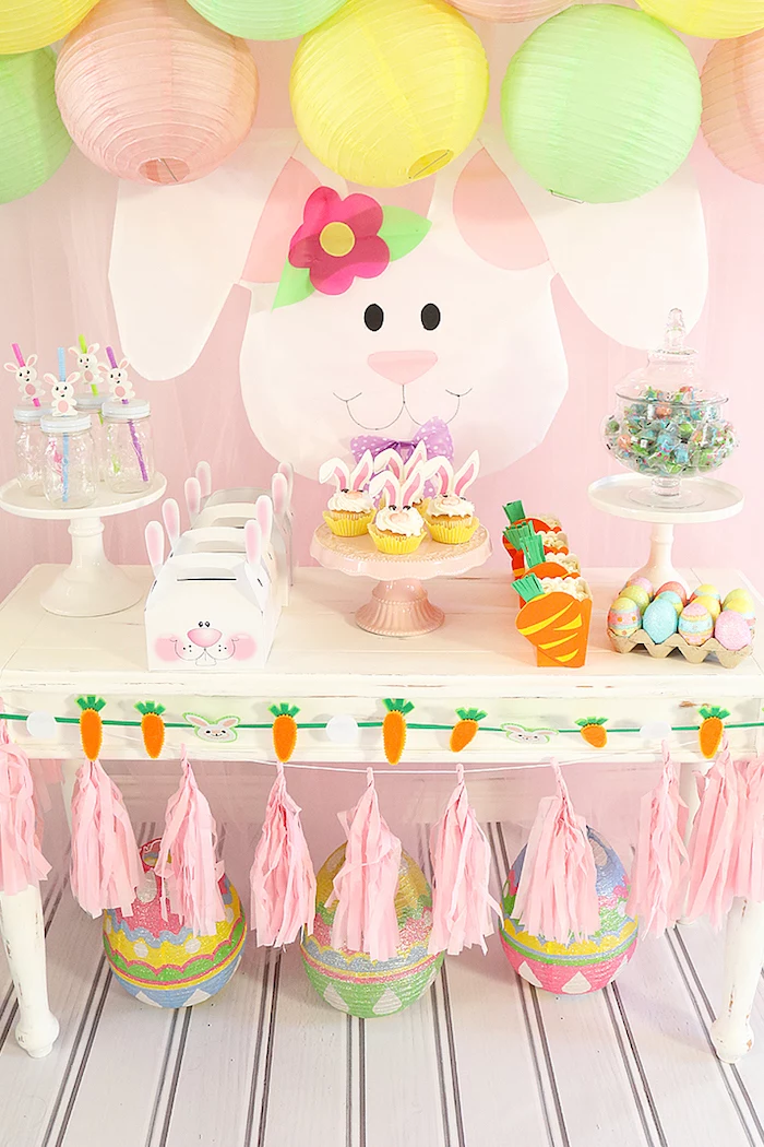 pink green and yellow decorations, tassel garland, little rabbit theme, cupcakes and candy, baby shower themes