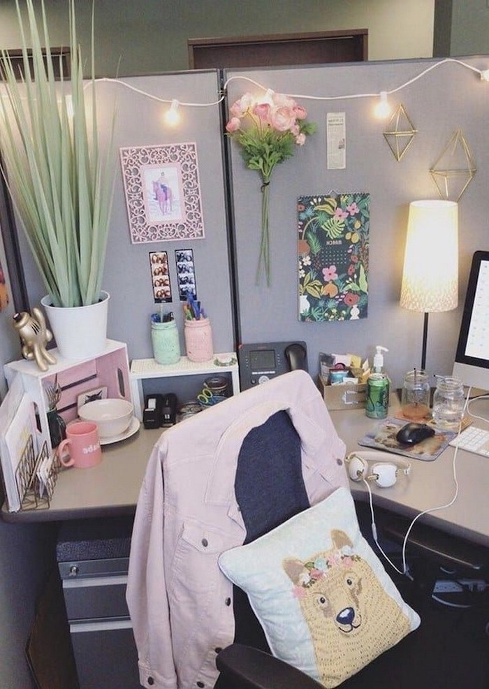 floral decor, wooden desk organiser, cool office decor, wooden desk, grey chair, pink jacket, mason jar, pencil holders