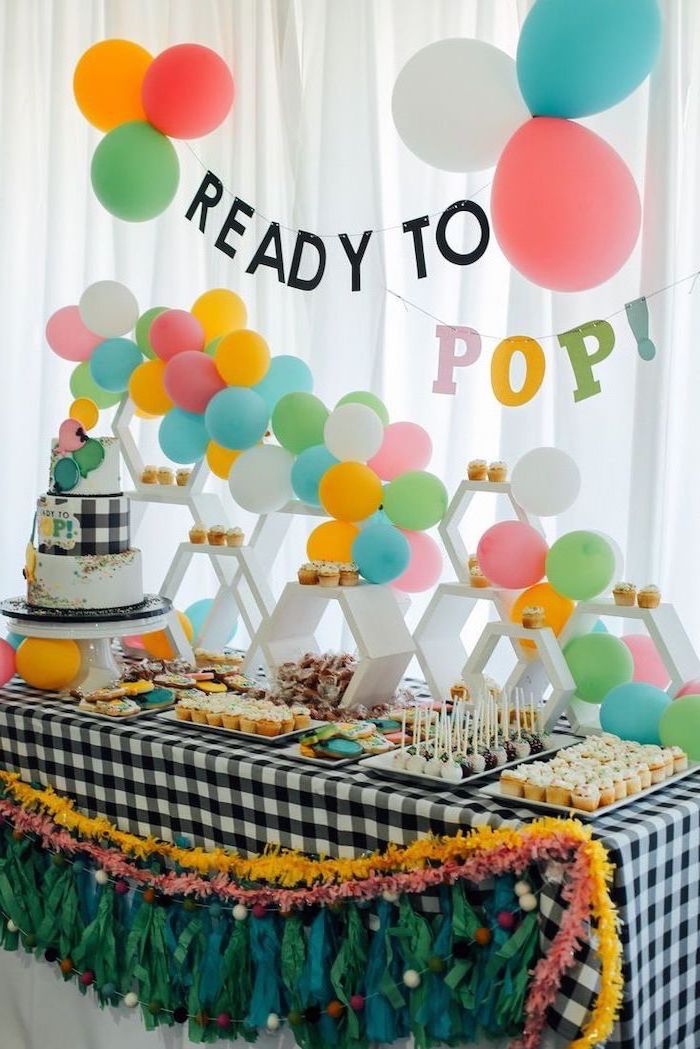 ready to pop, baby shower ideas for girls, colorful balloons, dessert table, three tier cake on it