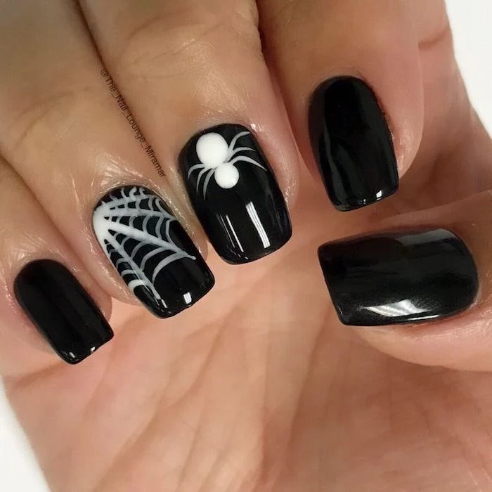 black nail polish, october nails, white spider webs, spider decorations, short squoval nails