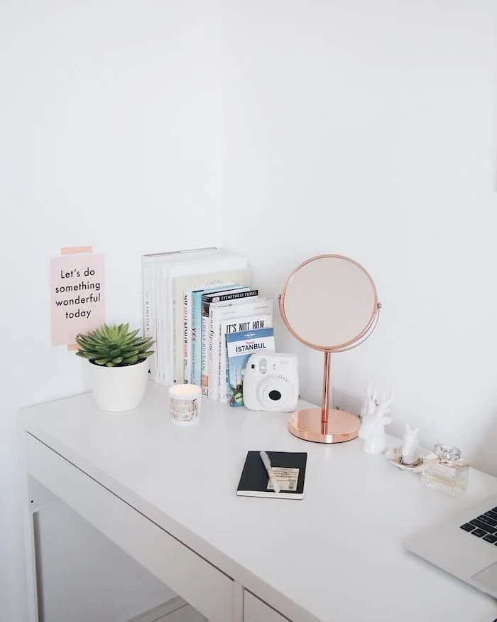 cool office decor, white desk, rose gold mirror, potted succulent, polaroid camera, white wall