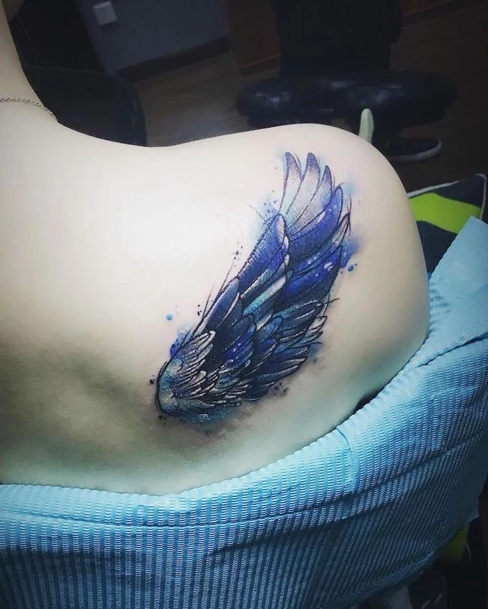watercolor tattoo, angel tattoos for men, shoulder tattoo, blue sheet of paper, blue and purple colors