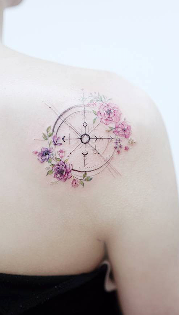simple compass tattoo, purple and pink flowers, shoulder tattoo, white background, black top