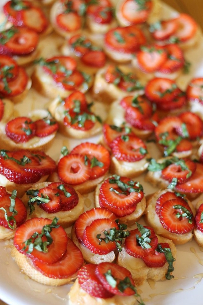 bruschetta bites, with strawberry slices on top, brunch recipe ideas, white plate