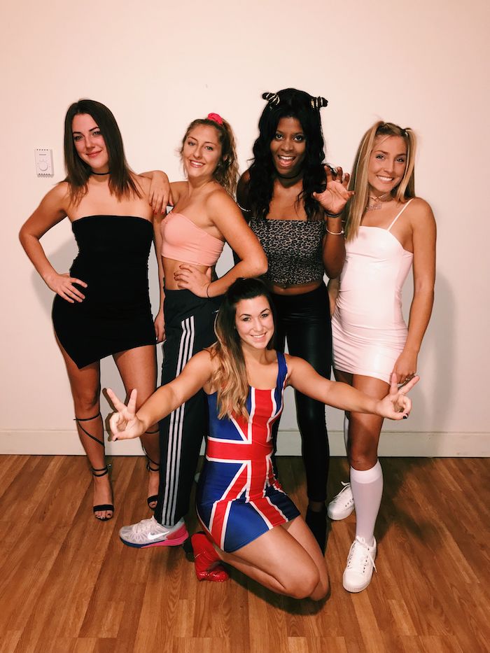 five women, dressed as the spice girls, famous halloween characters, wooden floor, white wall