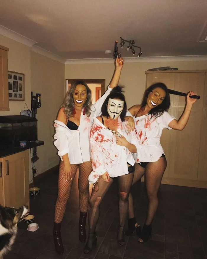 three women, dressed as characters from the purge, halloween costume ideas for men, wearing masks