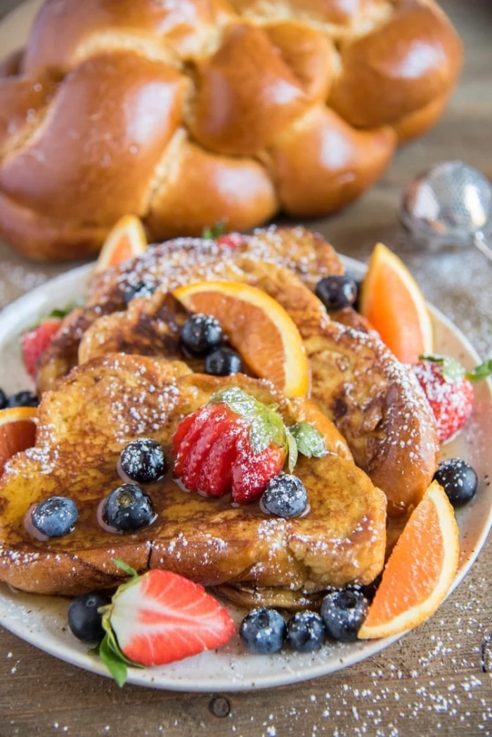 french toast, breakfast recipes, blueberries and strawberries on top, orange slices