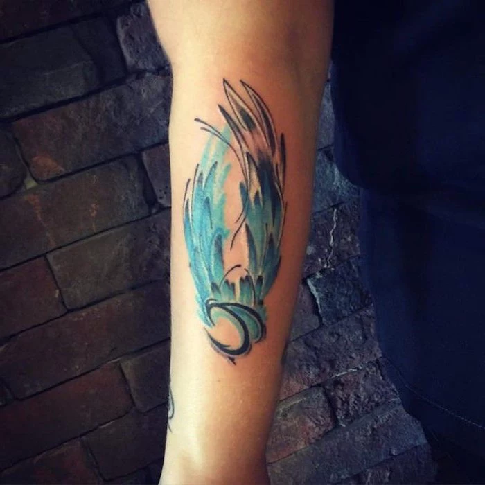 brick wall, watercolor tattoo, wing tattoo on arm, forearm tattoo, blue color