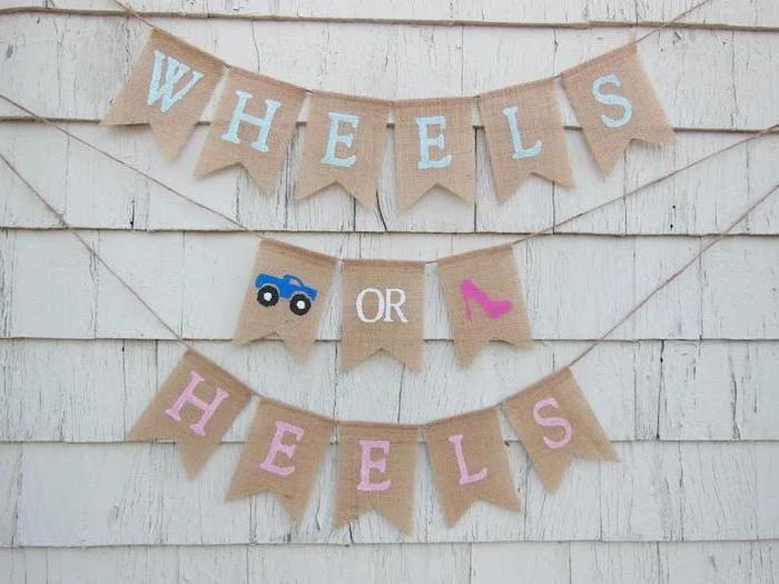 wheels or heels, large banner, gender reveal ideas pinterest, white wooden wall