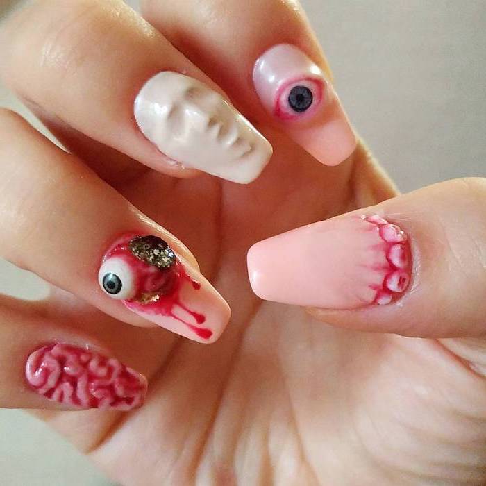 pink and white nail polish, orange ombre nails, squoval nails, eyes and brains, screaming face decorations