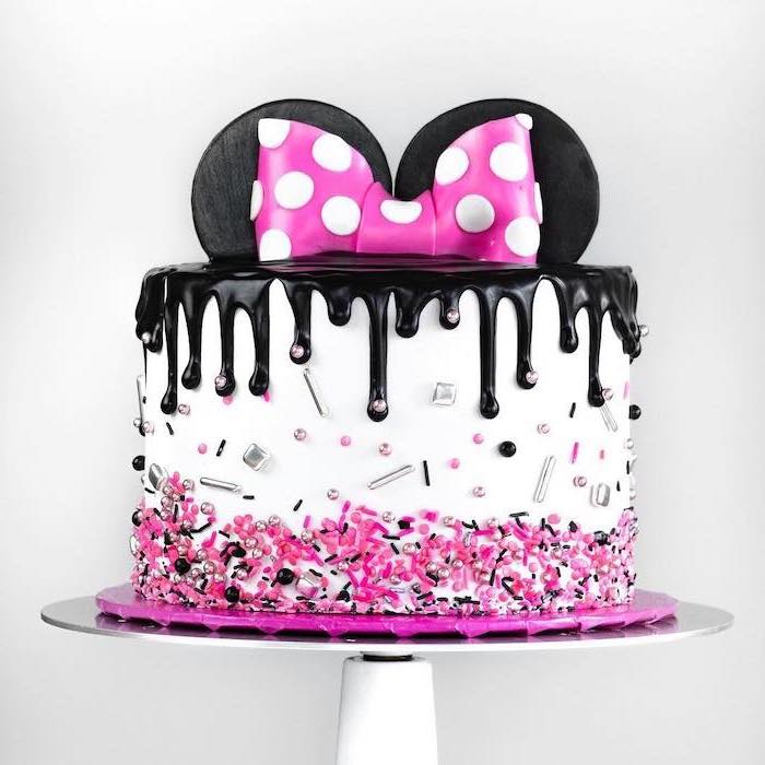 white fondant, black frosting, how to make a minnie mouse cake, colorful sprinkles, white cake stand