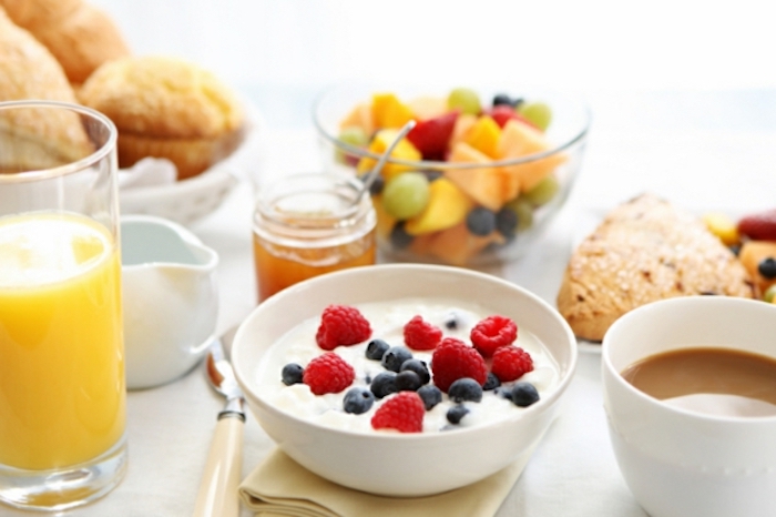 bowl of yoghurt, raspberries and blueberries, orange juice, vegan brunch recipes, fruit bowl