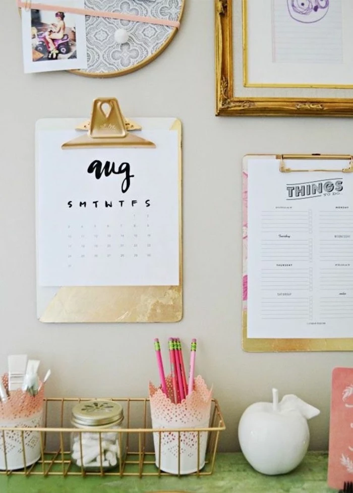 ideas for decorating your office at work, hanging folders, golden frame, golden basket, pencil holders