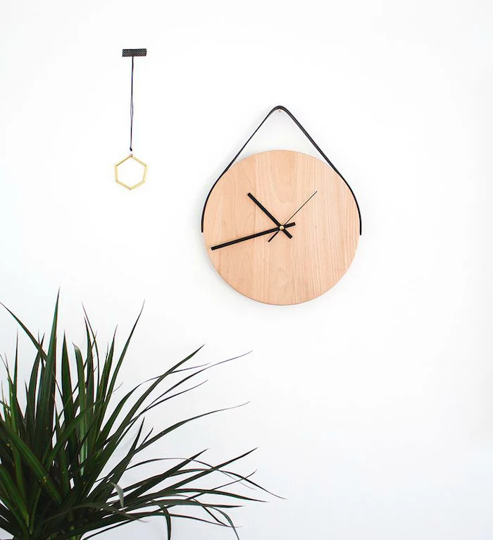 cubicle decor ideas, wooden clock, on a white wall, potted plant
