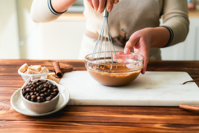 wooden surface, instant coffee and sugar mixed together in glass bowl, cloud coffee recipe