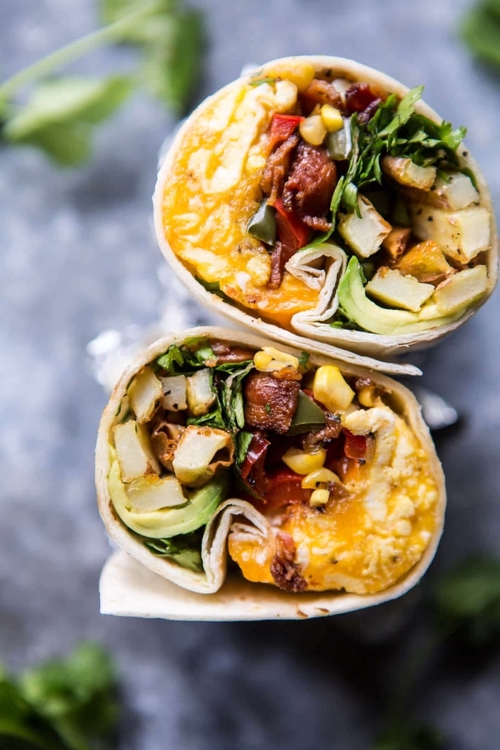 wrapped burritos, breakfast recipe ideas, eggs and bacon, green salad and corn inside