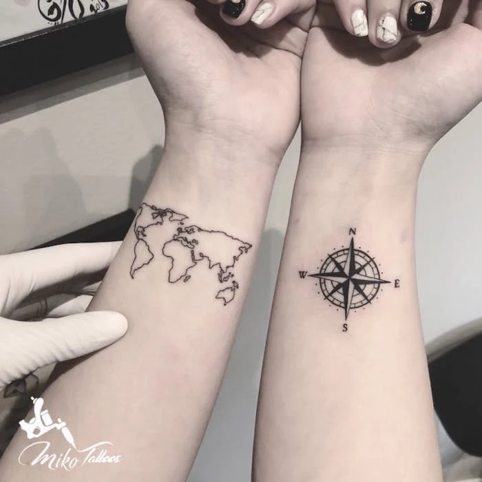 map of the world, wrist tattoo, compass tattoo design, rubber gloves, black and white nail polish