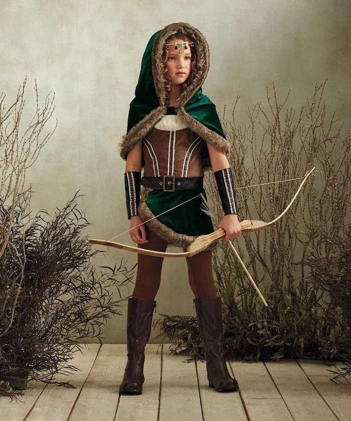 girl in archer's clothing, halloween costumes for girls, holding a bow and arrow, medieval costumes