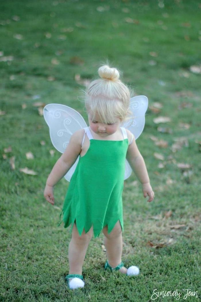 little girl, with blonde hair, dressed as tinkerbell, halloween costumes for kids girl, green dress, white wings