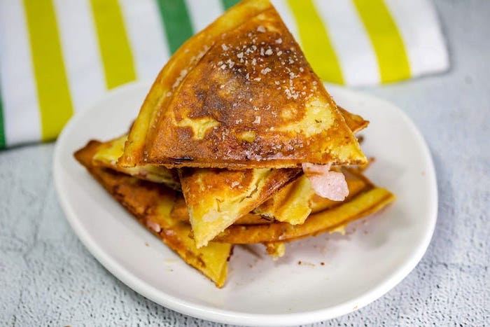 ham and cheese quesadillas, easy keto breakfast, white plate, white table, green yellow and white cloth