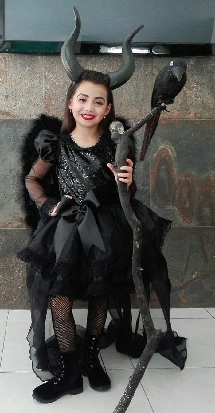 toddler halloween costumes, girl dressed as maleficent, black satin gown, with tulle and sequins