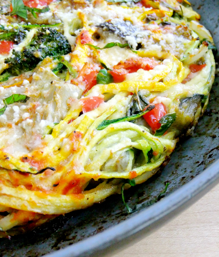zucchini noodles pizza, how to cook zoodles, with broccoli, chopped tomatoes, parsley on top