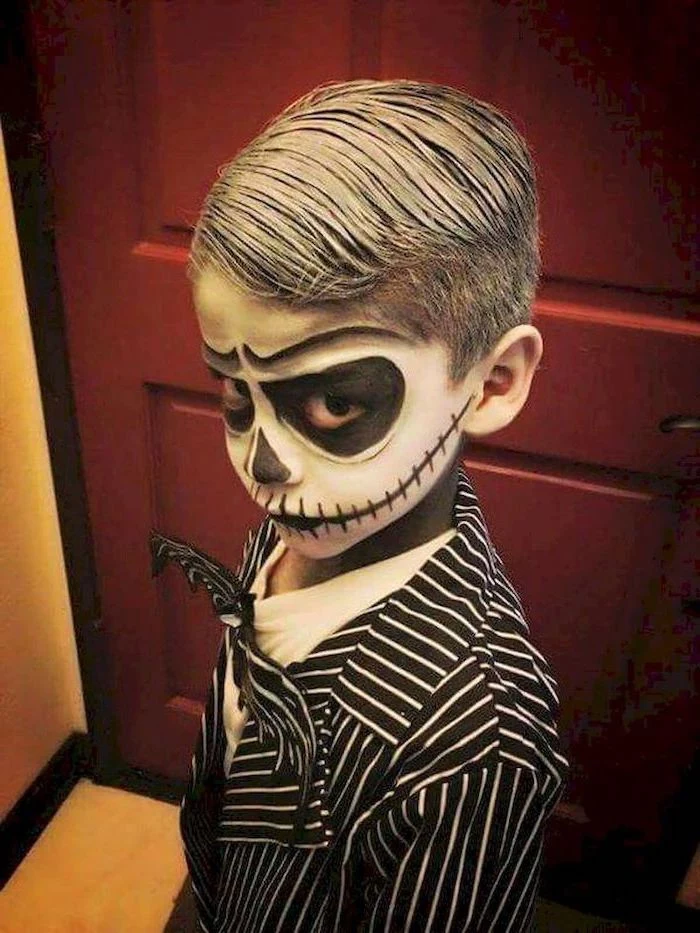 little boy, dressed as jack skellington, with face makeup, toddler halloween costumes, nightmare before christmas inspired