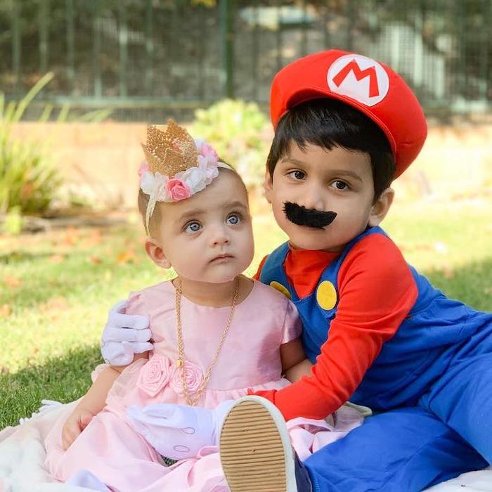 toddler boy costume, boy dressed as super mario, baby girl dressed as princess peach, pink dress