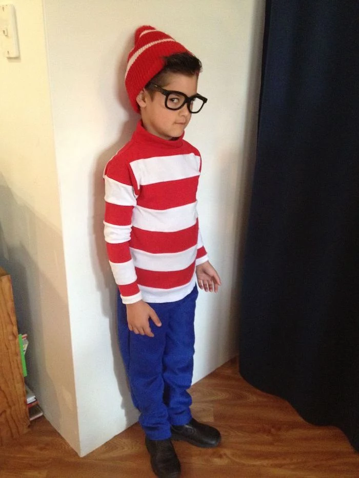 boy dressed as waldo, red and white striped shirt, toddler halloween costumes, red beanie, blue pants