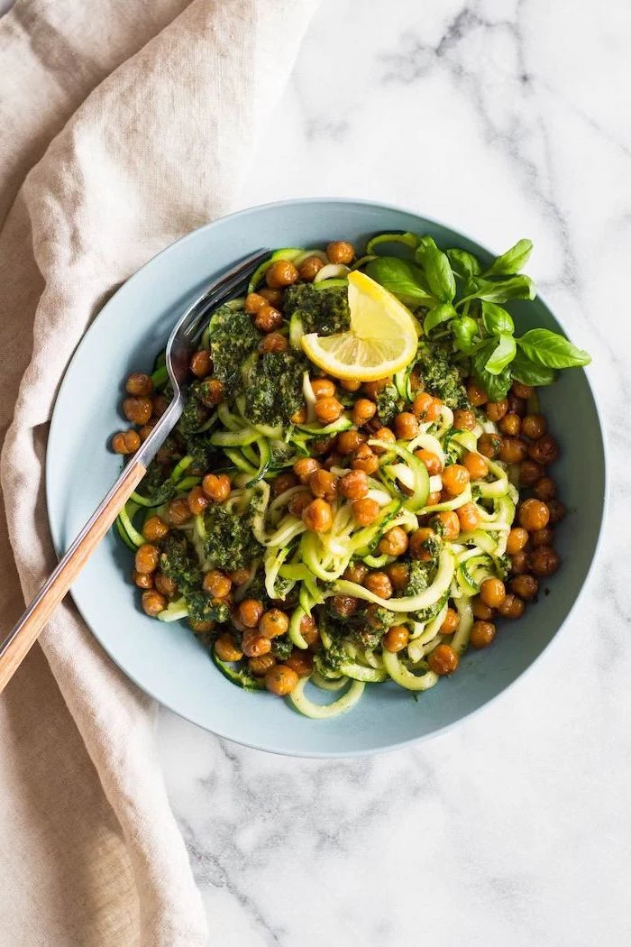 zoodles with chickpeas, how to cook spiralized zucchini noodles, lemon slice, on the side, basil leaves