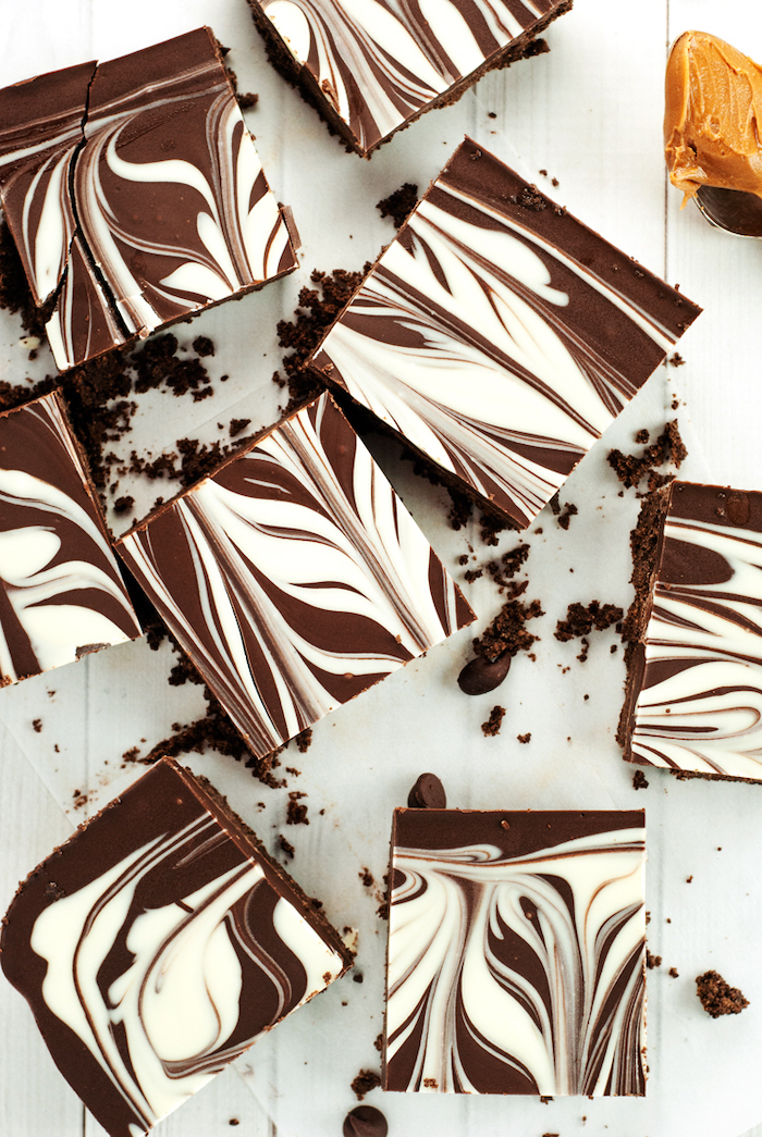no bake recipes, chocolate cookie bars, white and dark chocolate on top, white wooden table